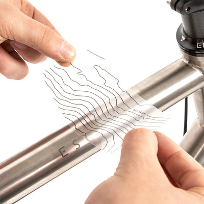 Applying the sticker to the bike 