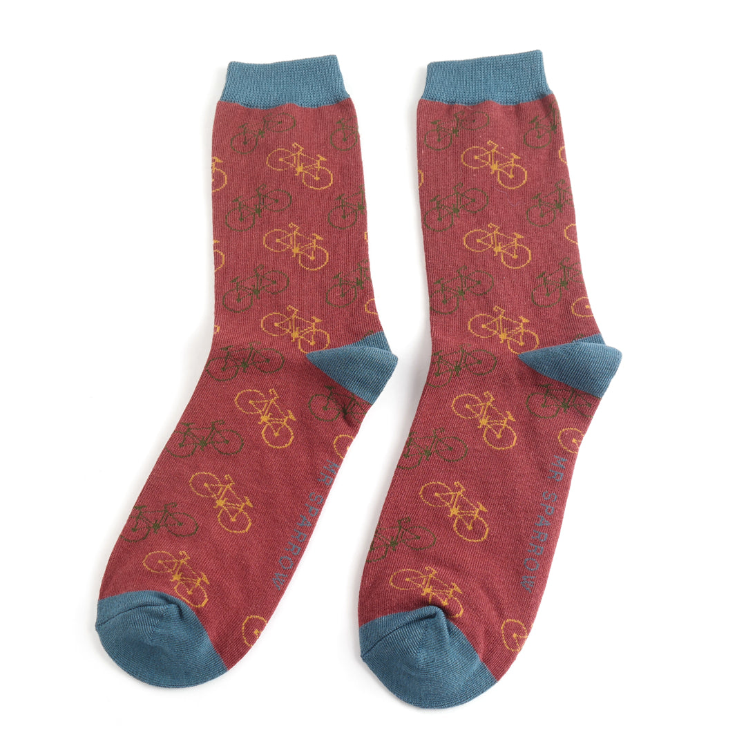 Red socks with bicycle pattern and blue accents on a white background