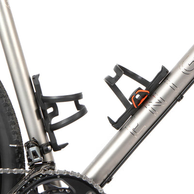 Close-up of a bicycle with two water bottle cages on a white background
