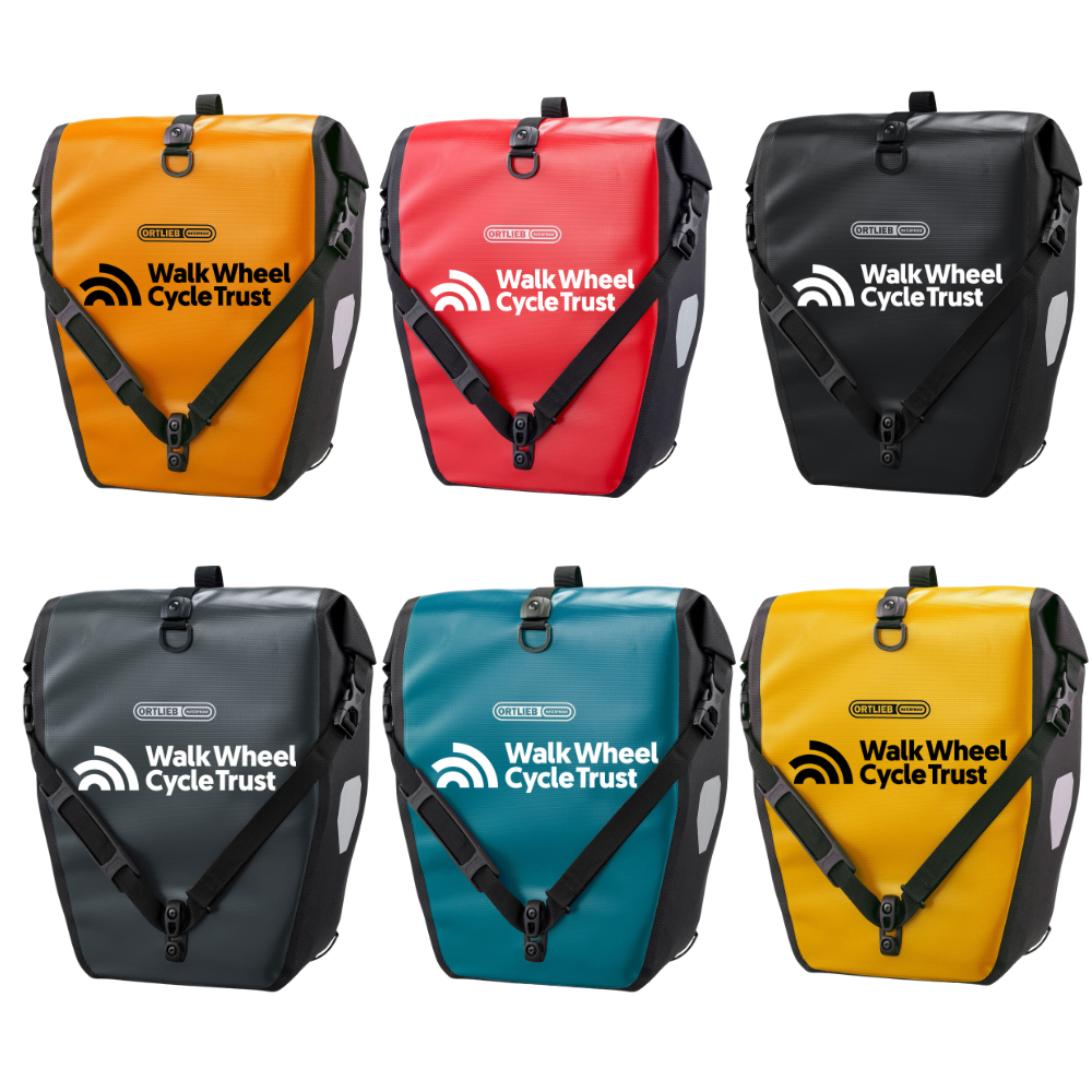 Walk Wheel Cycle Trust branded panniers. Shown in orange, red, black, asphalt, petrol and sun yellow. 