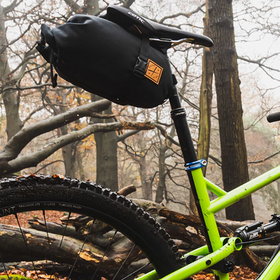 Action shot of saddle pack by restrap with roll top. 4.5L